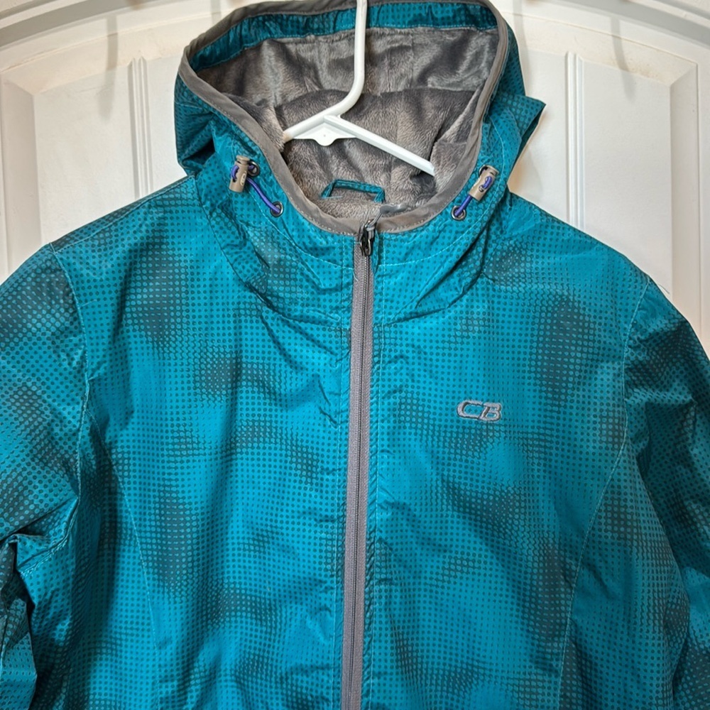 Women’s CB sports jacket. Size XL. 100% teal polyester. Soft lining. Hooded.